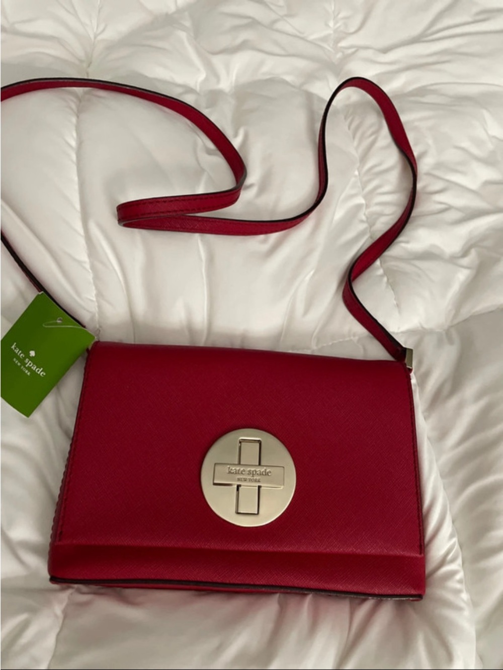 kate spade red leather crossbody with gold medallion